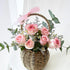 Compact basket of pink roses